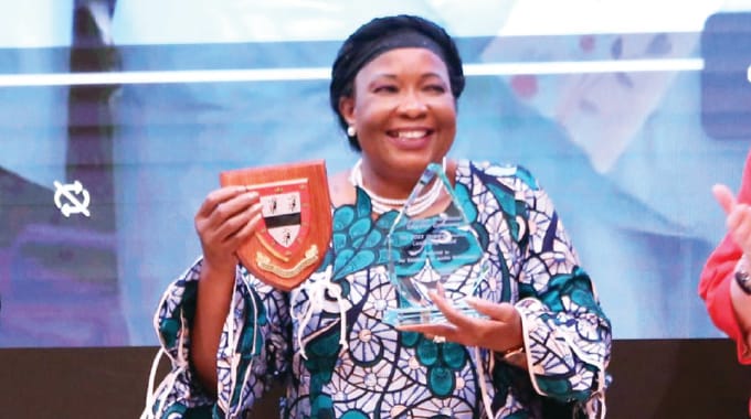 First Lady Dr Auxillia Mnangagwa displays her Global Education Leadership Award presented to her in recognition of her outstanding contribution to education, women and the girl child empowerment