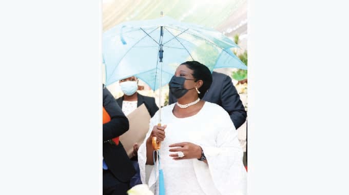 First Lady Dr Auxillia Mnangagwa admires an umbrella, one of the gifts she received from the visiting Vice Chancellors of Russian Universities at State House yesterday.