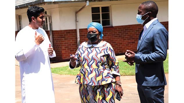 First Lady Auxillia Mnangagwa talks to Mr Toukeer Kazi (left) who donated an assortment of goods to Angel of Hope Foundation while Amai Mnangagwa's son (right) looks on at Zimbabwe House on Friday. Pictures: John Manzongo