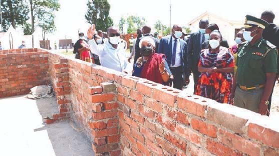 First Lady Auxillia Mnangagwa, Minister of State and Devolution for Mashonaland East Aplonia Munzverengwi and Zimbabwe Prisons and Correctional Services Commissioner-General Moses Chihobvu assess the hospital under construction courtesy of Angel of Hope Foundation at Marondera Female Open Prison on Tuesday.