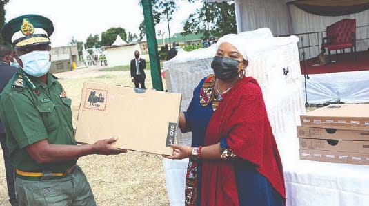 First Lady Auxillia Mnangagwa hands over laptops to Zimbabwe Prisons and Correctional Services Commissioner-General Moses Chihobvu at Marondera Female Open Prison on Tuesday. – Pictures: John Manzongo.