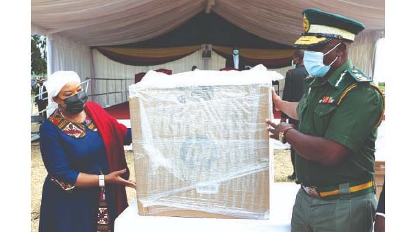 First Lady Auxillia Mnangagwa hands over laptops to Zimbabwe Prisons and Correctional Services Commissioner-General Moses Chihobvu at Marondera Female Open Prison on Tuesday.