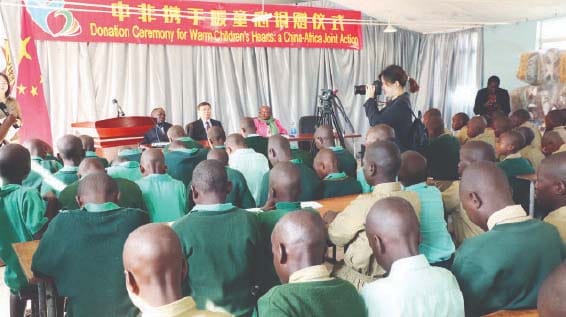 Learners follow proceedings during the handover of an assortment of groceries, duvets, blankets, solar powered lights and stationery donated by Angel of Hope Foundation and the Chinese First Lady Peng Liyuan to Hupenyu Hutsva children’s home in Harare.