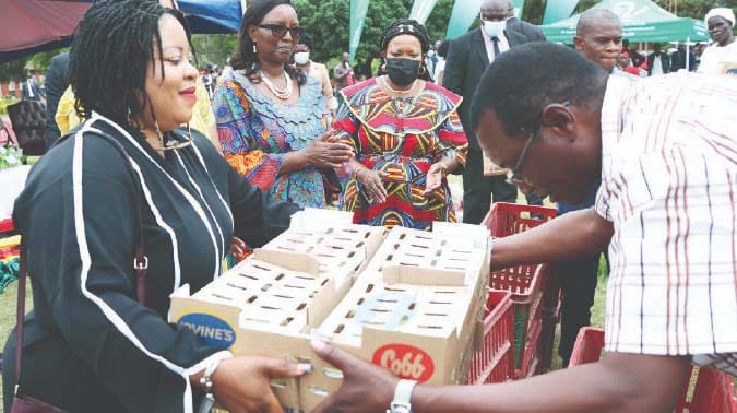 Spouses of African Ambassadors accredited to Zimbabwe, Mrs Wentso Ifu from Nigeria, Mrs Chifundo Polepole from Malawi and Mrs Umutesi Katushabe Julian from Rwanda hand over day old chicks donated by Angel of Hope Foundation to beneficiaries, while First Lady Dr Auxillia Mnangagwa, who is patron of Agriculture-for-She look on after the launch of Urban Transformation Programme in Dzivaresekwa, Harare on Monday