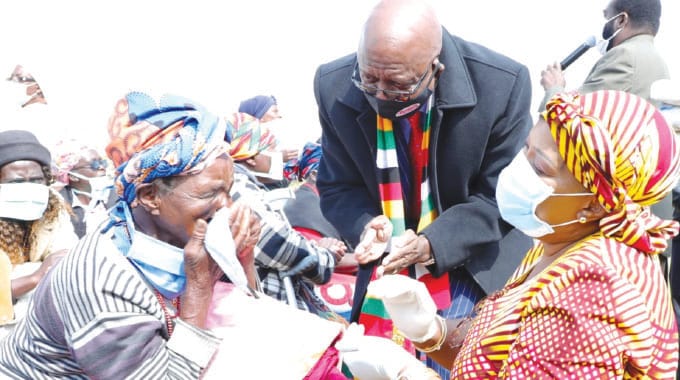 First Lady Auxillia Mnangagwa interacts with a senior citizen who was overwhelmed by her assistance in the Midlands last year. Looking on is Midlands Provincial Affairs Minister Larry Mavhima