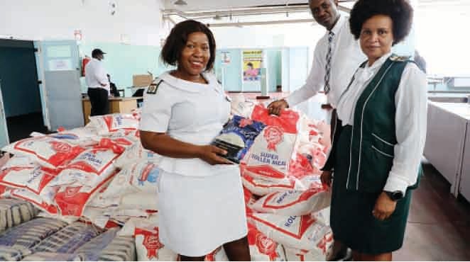 Mpilo Central Hospital staff display the mealie meal and rice donated by Health Ambassador, First Lady Dr Auxillia Mnangagwa to hospitals in Bulawayo