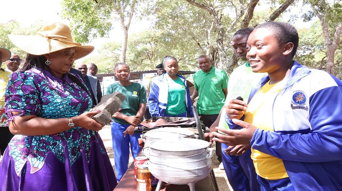 Environmental patron First Lady Dr Auxillia Mnangagwa looks at a paving block made by Rufaro High School learners from recycled materials, at the national Clean Schools Competition awards ceremony in Masvingo