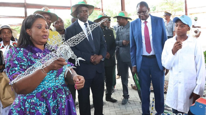 First Lady Dr Auxillia Mnangagwa admires an eagle artefact made by learners from recycled materials, at the national Clean Schools Competition awards ceremony in Masvingo