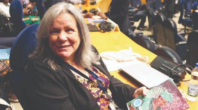 Ms Kathi Shea, a delegate from the United States holds First Lady Dr Auxillia Mnangagwa’s Angel of Hope Foundation magazine during the 28th OAFLAD general assembly in Addis Ababa, Ethiopia, yesterday