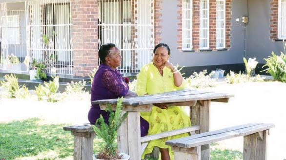 First Lady Dr Auxillia Mnangagwa in a heart-to-heart discussion with Gogo Getrude Mberi at her house in Waterfalls, Harare on Wednesday