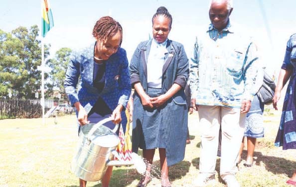 Botswana First Lady Mrs Neo Jane Masisi waters her country’s tree which is planted at the Museum of African Liberation while Instak chairman Professor Simbi Mubako and Botswana Ambassador to Zimbabwe Sarah Molosiwa (centre) look on, on Thursday