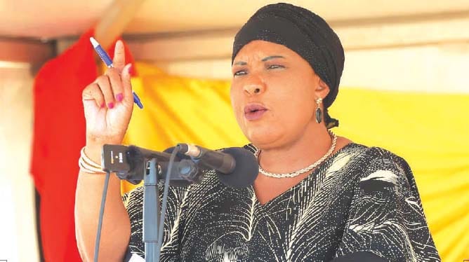 First Lady Dr Auxillia Mnangagwa addresses the crowd during an interactive session after she officially commissioned the 7,2km piped water scheme in Muzarabani yesterday