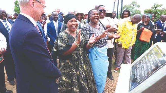 First Lady Dr Auxillia Mnangagwa shares a lighter moment with Swedish Ambassador to Zimbabwe Mr Per Lindgarde and beneficiaries after she unveiled a plaque to officially commission the 7,2km piped water scheme in Muzarabani yesterday