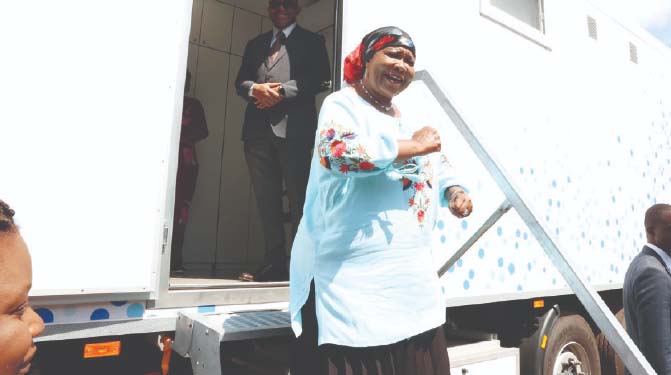 Health Ambassador First Lady Dr Auxillia Mnangagwa shares a lighter moment while demonstrating how women should get into the ultra-modern top notch mobile hospital for breast cancer screening at Parirenyatwa Group of Hospitals yesterday