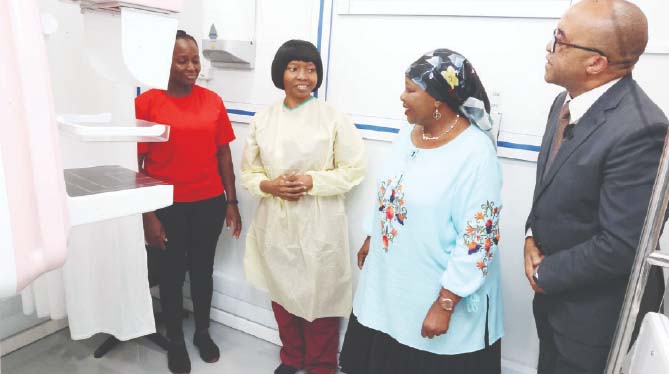 Angel of Hope Foundation patron First Lady Dr Auxillia Mnangagwa talks to a cancer patient (far left) as she was about to be screened for breast cancer in the digital mammography unit in the ultra-modern mobile hospital, while radiographer Ms Farai Maguduru (second from left) and Dr George Jakanani look on at Parirenyatwa Group of Hospitals yesterday