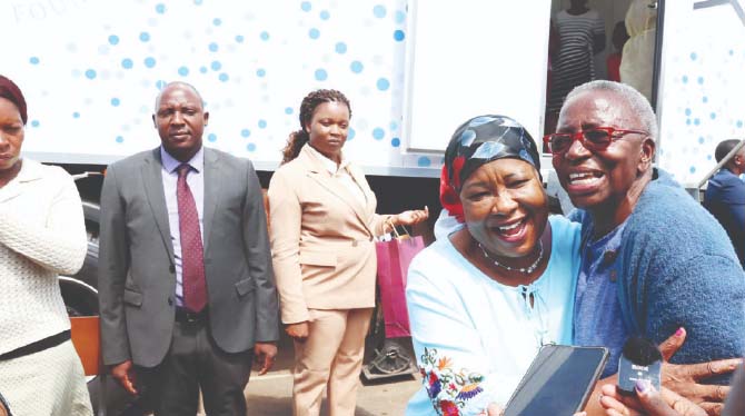 Gogo Egfa Mashoko, who could not contain her excitement of being screened for breast cancer for free, hugs First Lady Dr Auxillia Mnangagwa and thanks her for championing and prioritising the health of citizens during an Angel of Hope Foundation cancer screening programme in the ultra-modern top-notch mobile hospital at Parirenyatwa Group of Hospitals yesterday. – Pictures: John Manzongo