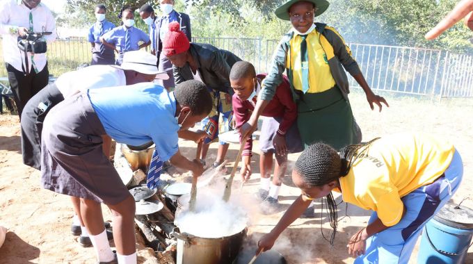 Girls prepare Zimbabwean traditional dishes during the Nhanga programme organised by First Lady Dr Auxillia Mnangagwa at the 44th Independence celebrations Children’s party in Murambinda, Manicaland yesterday