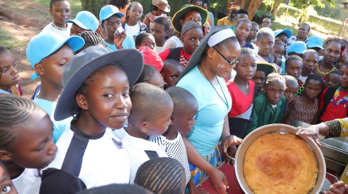 Girls are shown the traditional bread they baked during one of their cooking lessons at the weeklong boot camp organised by First Lady Dr Auxillia Mnangagwa