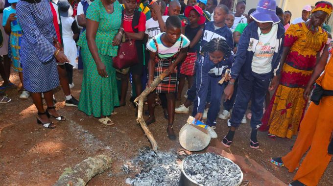 Girls attending a week-long boot camp organised by First Lady Dr Auxillia Mnangagwa baking traditional bread 