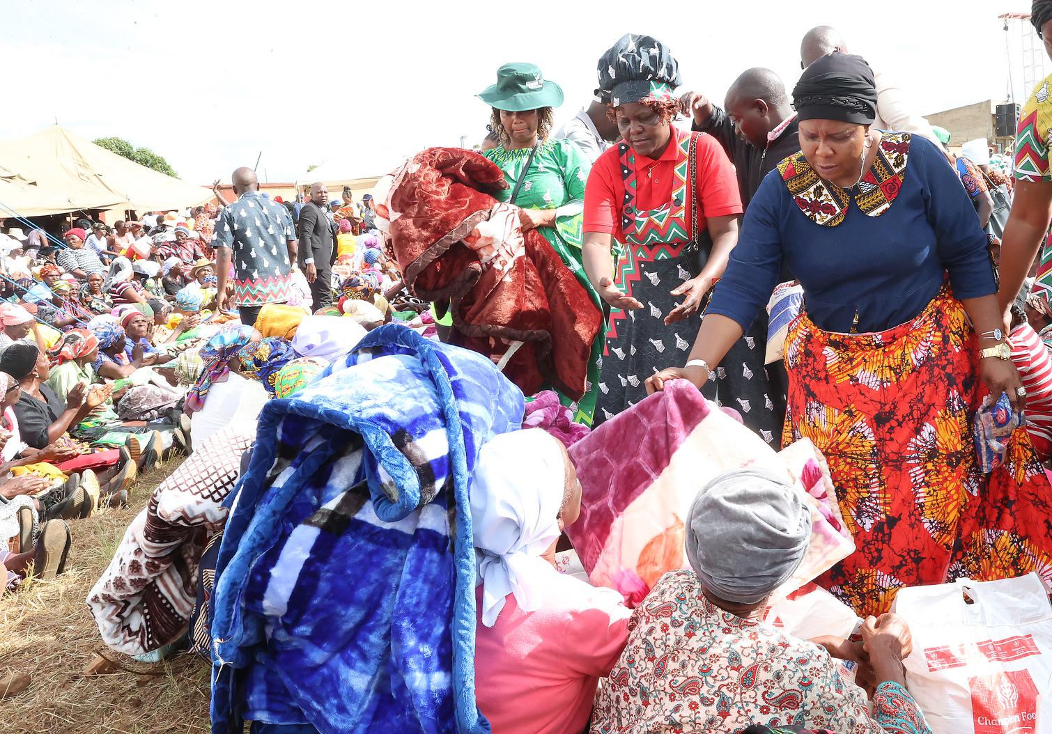 First Lady Dr Auxillia Mnangagwa hands over blankets, clothes, food hampers and other goods to the elderly, those living with disabilities, child headed families and other vulnerable groups in Mutasa, Manicaland yesterday. — Pictures: John Manzongo