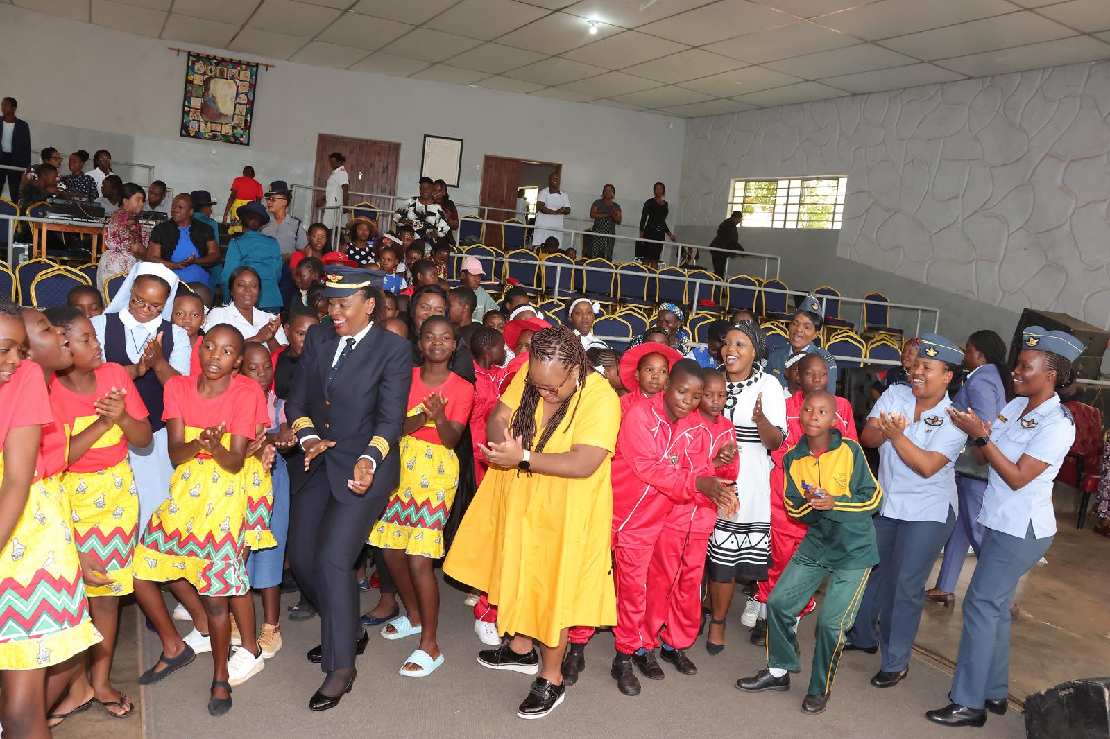 Career guidance resource persons join girls attending the week-long boot camp on the dance floor during the First Lady’s career guidance workshop yesterday