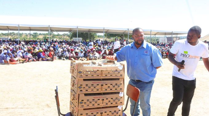 Irvine’s customer service and broiler development manager Mr Edwin Ngonyama and Mr Denford Sibanda from Profeeds who were brought by First Lady Dr Auxillia Mnangagwa to teach widows how to breed chickens explain the process during the launch of the First Lady’s Widows Association in Mashonaland Central yesterday