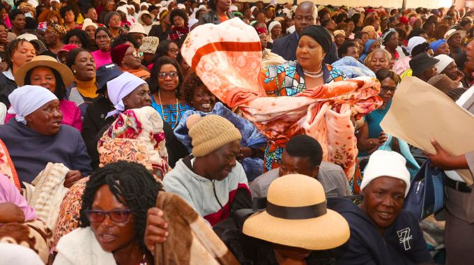 First Lady Dr Auxillia Mnangagwa hands over blankets to female war veterans, spouses and widows of veterans of the liberation struggle in Harare yesterday. — Pictures: John Manzongo