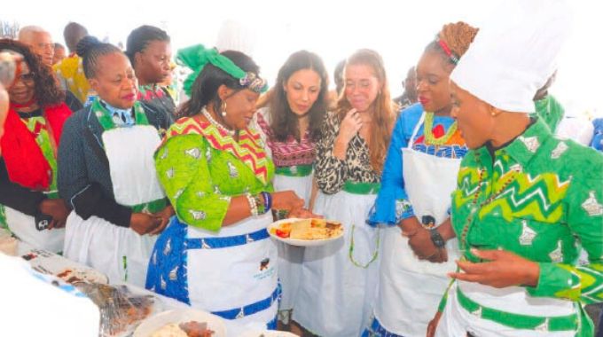 First Lady Dr Auxillia Mnangagwa, UN Tourism programme officer Ms Zineb Remmal, UN Tourism technical coordinator Ms Maria Soledad Gaido Malawi Minister of Tourism Ms Vera Kamtukule and Tourism and Hospitality Industry Minister Barbra Rwodzi admire traditional dishes during Amai’s traditional meal cookout competition in Nyanga on Africa Day. — Pictures: John Manzongo