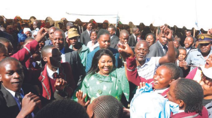 Health Ambassador First Lady Dr Auxillia Mnangagwa who invited television personality Oscar Pambuka join thousands of learners in song and dance during her engagement with them on the dangers of drugs and substance abuse in Harare yesterday. - Pictures: John Manzongo