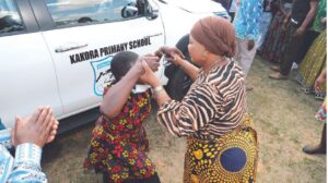 First Lady Dr Auxillia Mnangagwa hands over car keys to her former school Kakora Primary head Ms Tendai Mushore. The vehicle was donated by President Mnangagwa