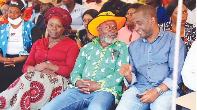 Former legislators Dr Sekai Nzenza (left), Cde Joseph Chinotimba and Grain Millers Association of Zimbabwe chairperson Dr Tafadzwa Musarara follow proceedings during the launch of the e-health and e-commerce centres in Mashonaland Central province