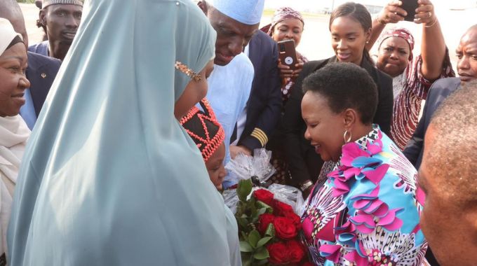 First Lady Dr Auxillia Mnangagwa is welcomed by Minister of State FCT Dr Mariya Mahmoud in Abuja, Nigeria