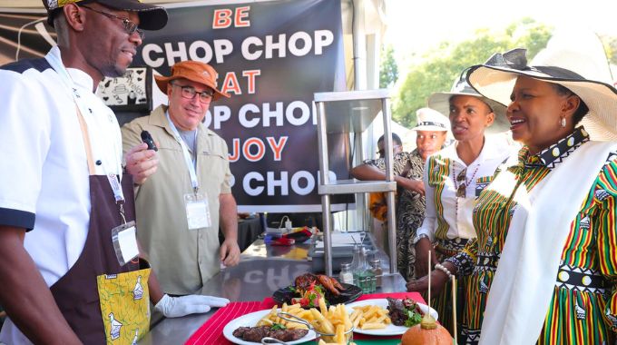 Chop Chop staff explain to First Lady Dr Auxillia Mnangagwa, Tourism and Hospitality Industry Minister Barbara Rwodzi and other delegates their products and how their business was benefiting from exhibiting at the inaugural Farm to Market and Arts festival organised and launched by Dr Mnangagwa in Harare