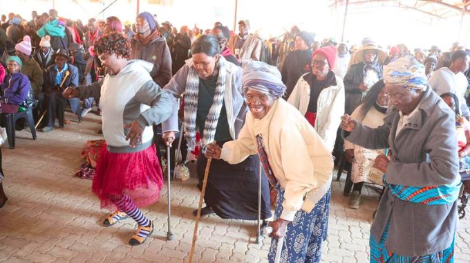 The elderly, those living with disabilities, children heading families and other vulnerable groups sing and dance during their interaction with First Lady Dr Auxillia Mnangagwa in Midlands province on Saturday