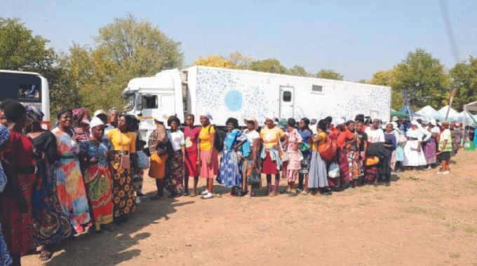 Women in Mashonaland East queue for cancer screening and treatment of other ailments from the new Angel of Hope Foundation ultra modern mobile hospital during a medical outreach organised by First Lady Dr Auxillia Mnangagwa. – Pictures: John Manzongo and Edward Zvemisha.