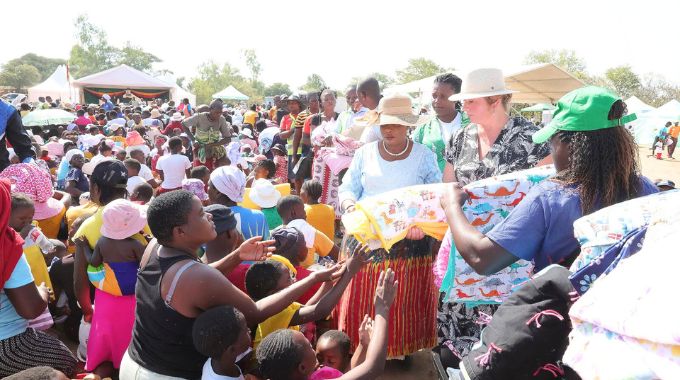 Angel of Hope Foundation patron First Lady Dr Auxillia Mnangagwa hands over mealie meal, clothes, school stationery and books, baby blankets and toys among other things sourced from her United States partners through her Angel of Hope Foundation during a medical outreach she organised in Mashonaland East. – Pictures: John Manzongo and Edward Zvemisha.