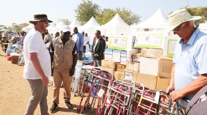 Mr Eric Rose hands over medical equipment brought by his team from the United States in collaboration with Angel of Hope Foundation to Mashonaland East Provincial Medical Director Dr Paul Matsvimbo during a medical outreach organised by First Lady in the province.