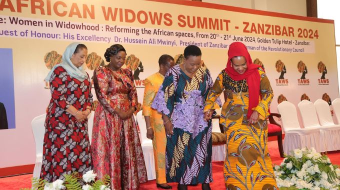 First Lady Dr Auxillia Mnangagwa and her Zanzibar counterpart Mrs Mariam Mwinyi walk hand in hand during the African Widows Summit in Zanzibar yesterday