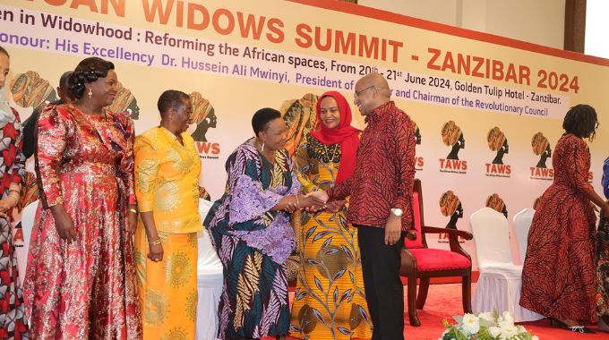 First Lady Dr Auxillia Mnangagwa is welcomed by the President of Zanzibar Dr Hussein Ali Mwinyi while his wife Mrs Mariam Mwinyi, former Tanzanian First Lady Mrs Anna Mkapa and other delegates look on during the African Widows Summit in Zanzibar yesterday. — Pictures: John Manzongo