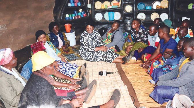 First Lady Dr Auxillia Mnangagwa and elderly women share a lighter moment with girls during an interactive nhanga programme in Chingwizi on Tuesday. - Pictures: John Manzongo