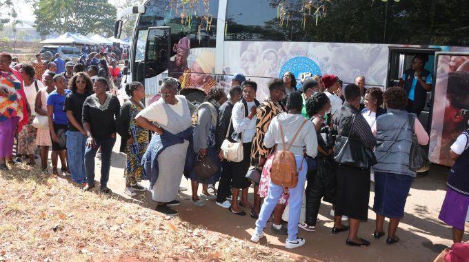 Women queue for cervical and breast cancer screening in the Angel of Hope Foundation mobile clinic brought by First Lady Dr Auxillia Mnangagwa at the City of Harare employee wellness funfair yesterday