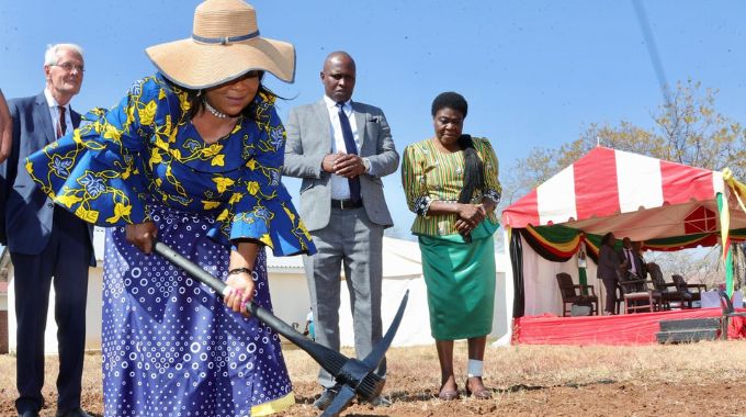 Health Ambassador First Lady Dr Auxillia Mnangagwa breaks the ground on the site where a cancer clinic is to be constructed while Mr Dick Rainsbury, Deputy Minister of Health Sleiman Timios Kwidini and Minister of State and Devolution for Bulawayo Judith Ncube look on