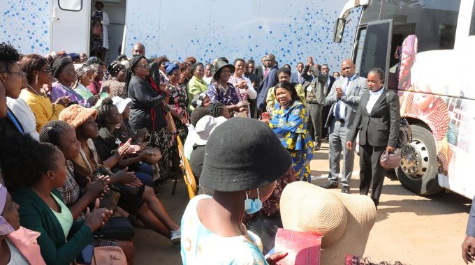 Health Ambassador First Lady Dr Auxillia Mnangagwa interacts with women awaiting cervical and breast screening from Angel of Hope Foundation top notch mobile hospital and also from the Angel of Hope Foundation mobile clinic at United Bulawayo Hospitals (UBH) yesterday