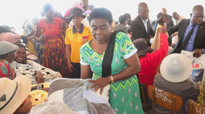 Minister of State and Devolution for Bulawayo Judith Ncube distributes blankets, winter jackets and food hampers donated by Angel of Hope Foundation to the elderly, those living with disabilities, child headed families and vulnerable members of society from Bulawayo, Matabeleland South and Matabeleland North yesterday