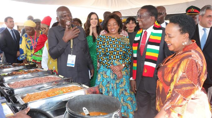 President Mnangagwa, First Lady Dr Auxillia Mnangagwa, UN Tourism secretary general MR Zurab Pololikashvili, Serbian First Lady Tamara Vucic, Angolan First Lady Anna Dias Lourenco and other delegates share a lighter moment as Ghana’s Ambassador to Zimbabwe Mr Alexander Ntrakwa explains his country’s traditional dishes during the UN Tourism Regional forum on gastronomy tourism for Africa in Victoria Falls yesterday