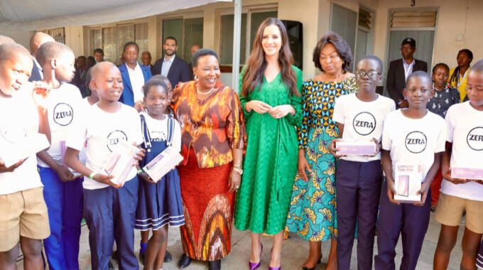 First Lady Dr Auxillia Mnangagwa, her Serbian and Angolan counterparts Mrs Tamara Vucic and Anna Dias Lourenco respectively pose for a photograph with Baobab primary school students during the handover of tablets to enhance the pupils ICT knowledge at their school in Victoria Falls on Friday. Pictures: John Manzongo