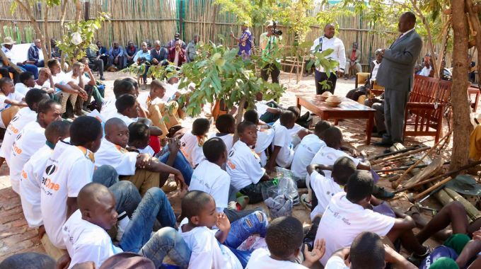 Deputy president of chiefs council Chief Fortune Charumbira and other elders teach boys traditional values, norms and skills expected of a Zimbabwean man during a gota programme organised by First Lady Dr Auxillia Mnangagwa in Victoria Falls