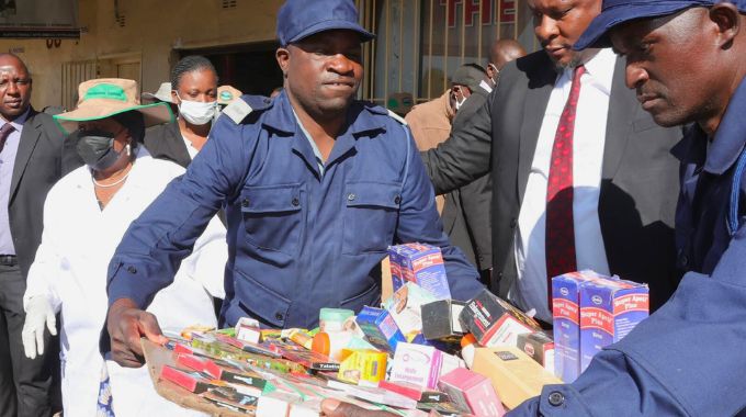 Health Ambassador First Lady Dr Auxillia Mnangagwa looks on as Zimbabwe Republic Police confiscate unlicensed medicines, skin lightening creams, sex-enhancing products such as super apetito, diprosone, epiderme cream, neoprosm, viagra among many other dangerous and harmful substances which were being sold on the streets by unlicenced dealers during the national clean up campaign in Harare yesterday. — Pictures: John Manzongo