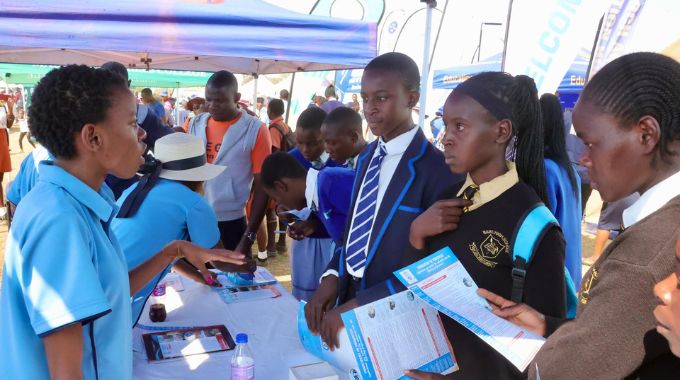 Schoolchildren listen to Ezekiel Guti University staff as they explain the various courses they offer during a career guidance programme in Mashonaland Central.