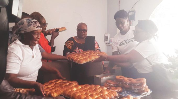 Mashonaland West Provincial Affairs and Devolution Minister Marian Chombo is shown buns being baked by widows under the Sanyati First Lady Widows Association